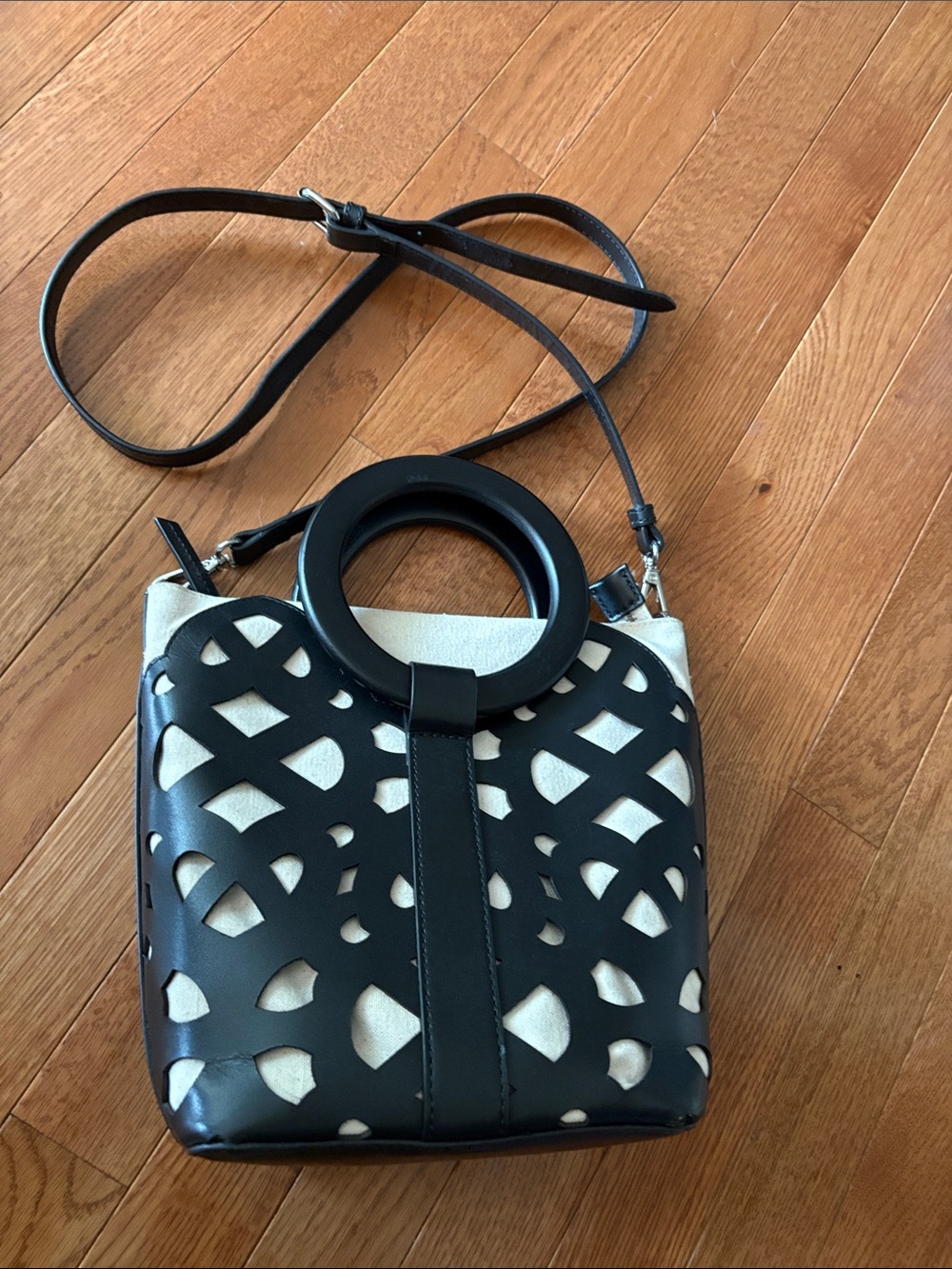 Chico’s Black Leather Cutout Crossbody Bag with Circular Wooden Handles